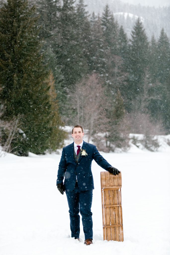 winter groom with sled