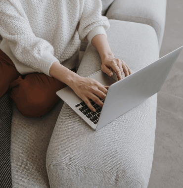 wedding marketing specialist typing on computer